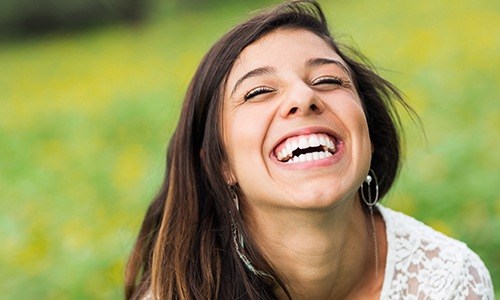 Laughing woman outdoors