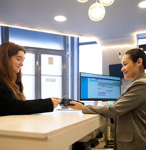 Woman paying for her dental treatment