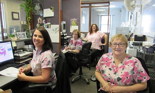 Four smiling members of our dental team