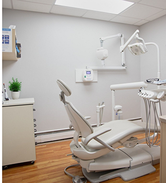 Empty white dental exam chair