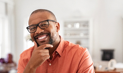 Mature man smiling with dentures in Worcester