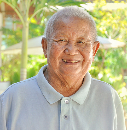 Smiling senior man with several missing teeth