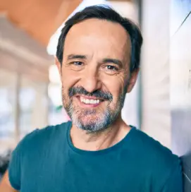 man in green shirt smiling