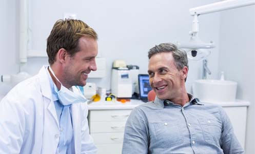 Patient smiling at his Worcester dentist after bruxism treatment 