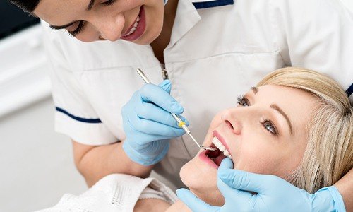 Woman receiving dental exam