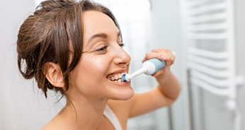 Woman brushing her teeth
