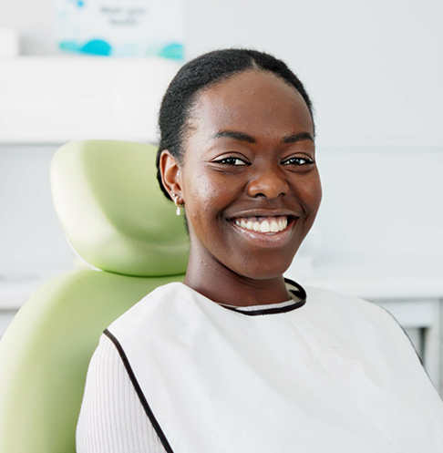 Woman smiling right before her dental treatment