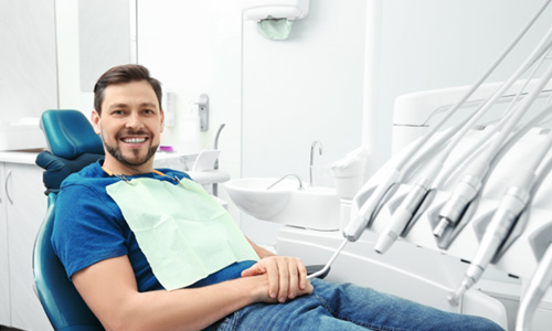 Smiling man in dental treatment chair