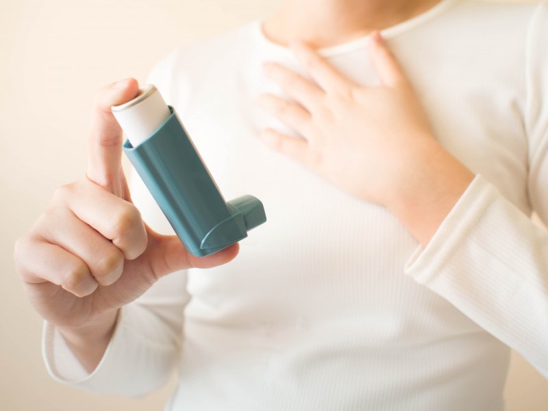 Closeup of patient with asthma holding their inhaler