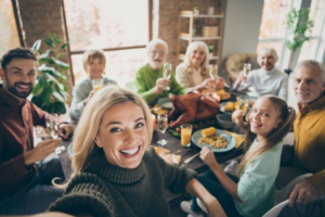 a group of people eating a Thanksgiving meal together