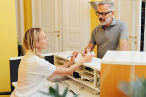 a patient paying their dental bill 